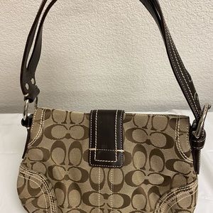 Coach linen/leather bag brown in color